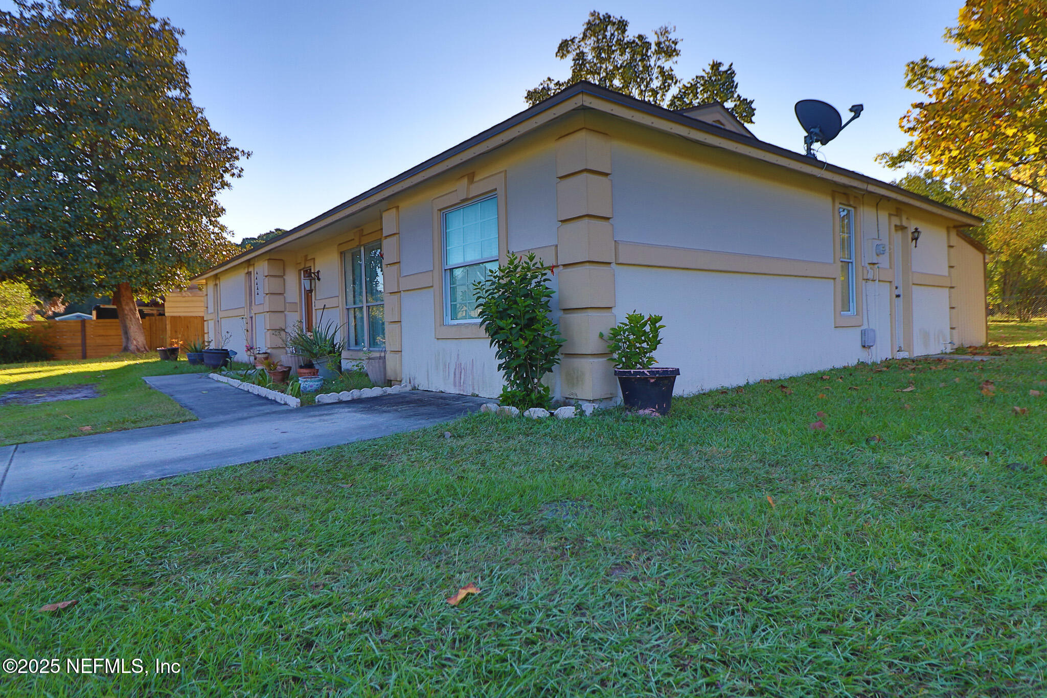 2847 Homestead Road Orange Park, FL 32065 - Photo 14 of 26 a front view of a house with garden