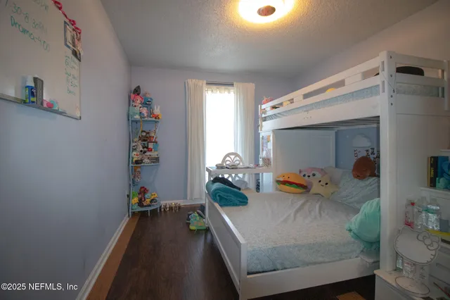 a bathroom with a toilet sink and shower curtain