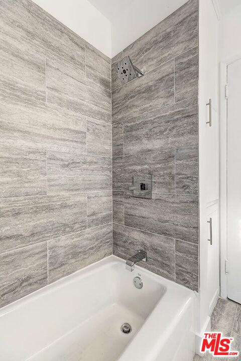 5022 Clinton Street, Unit 5022B Los Angeles, CA 90004 - Photo 12 of 22 a bathroom with a bathtub and shower