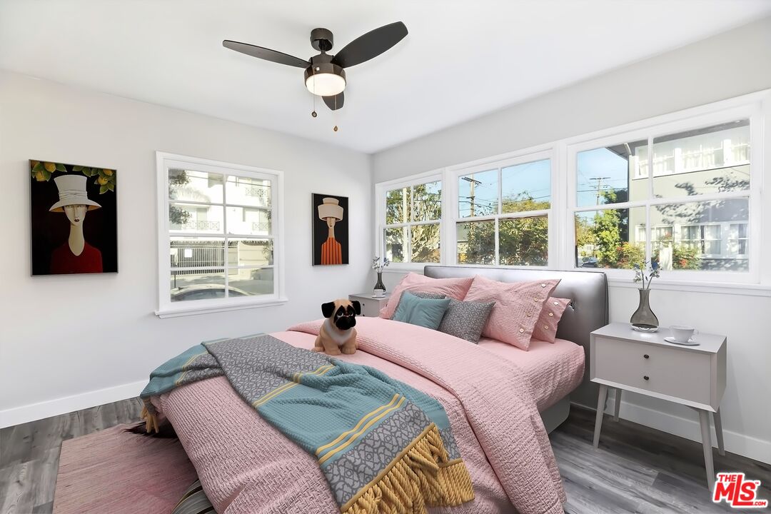 5022 Clinton Street, Unit 5022B Los Angeles, CA 90004 - Photo 13 of 22 a bedroom with a large bed and a window