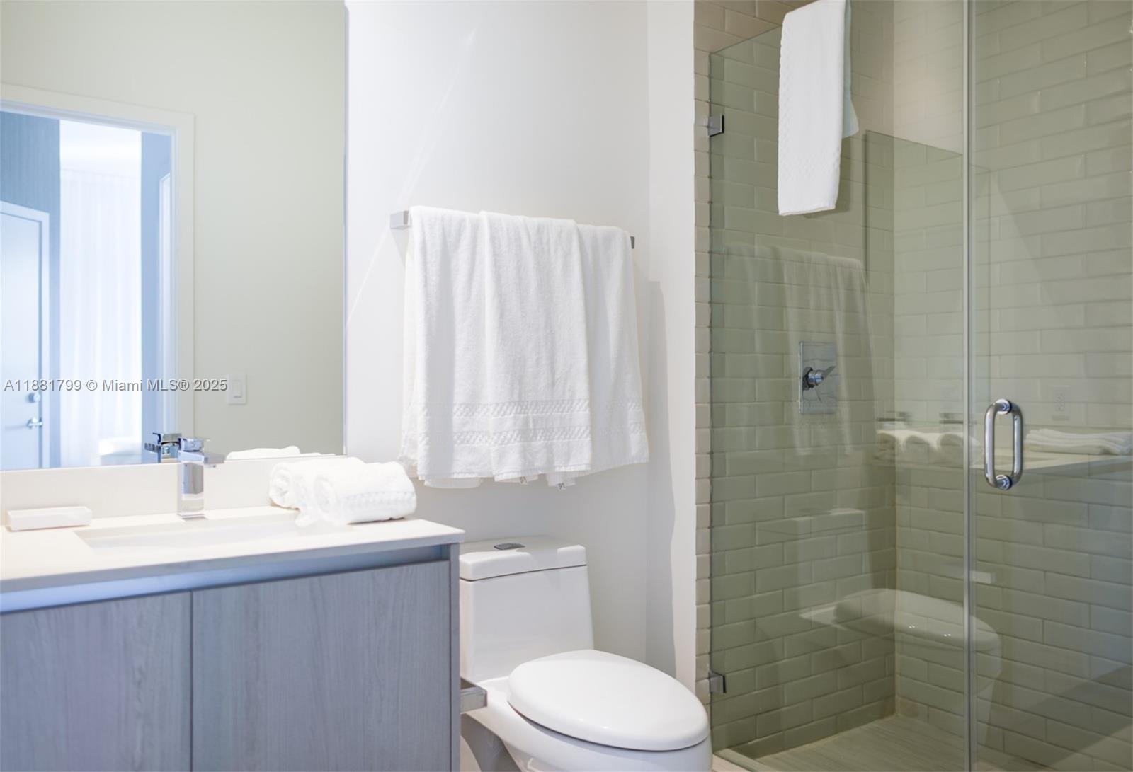 4010 South Ocean Drive, Unit R302 Hollywood, FL 33019 - Photo 20 of 34 a bathroom with a sink a toilet and shower