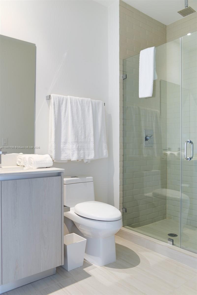 4010 South Ocean Drive, Unit R302 Hollywood, FL 33019 - Photo 21 of 34 a bathroom with a sink a toilet and shower
