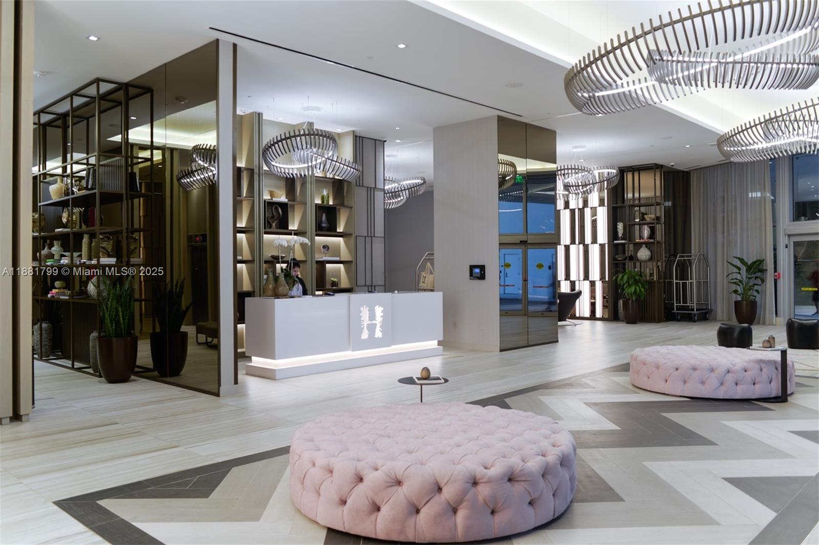 4010 South Ocean Drive, Unit R302 Hollywood, FL 33019 - Photo 31 of 34 a living room with a large mirror and furniture