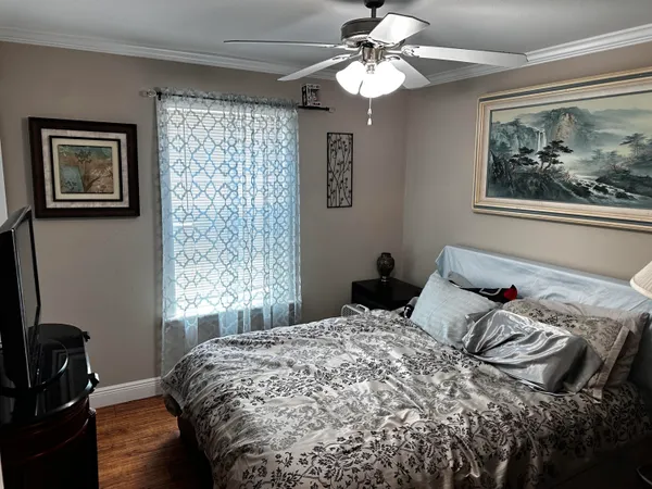 a bedroom with bed and a window