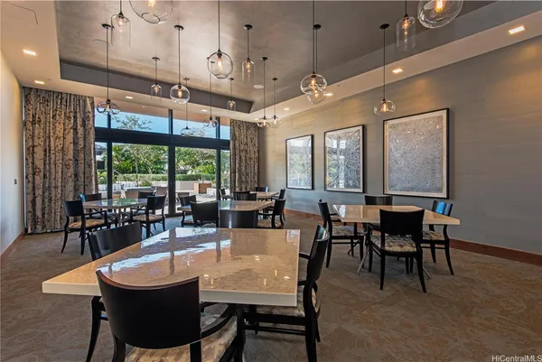 a large dining space with furniture window and outside view