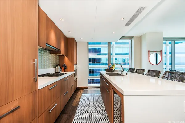 a kitchen with a stove and a sink