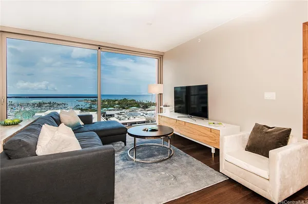 a living room with furniture and a flat screen tv