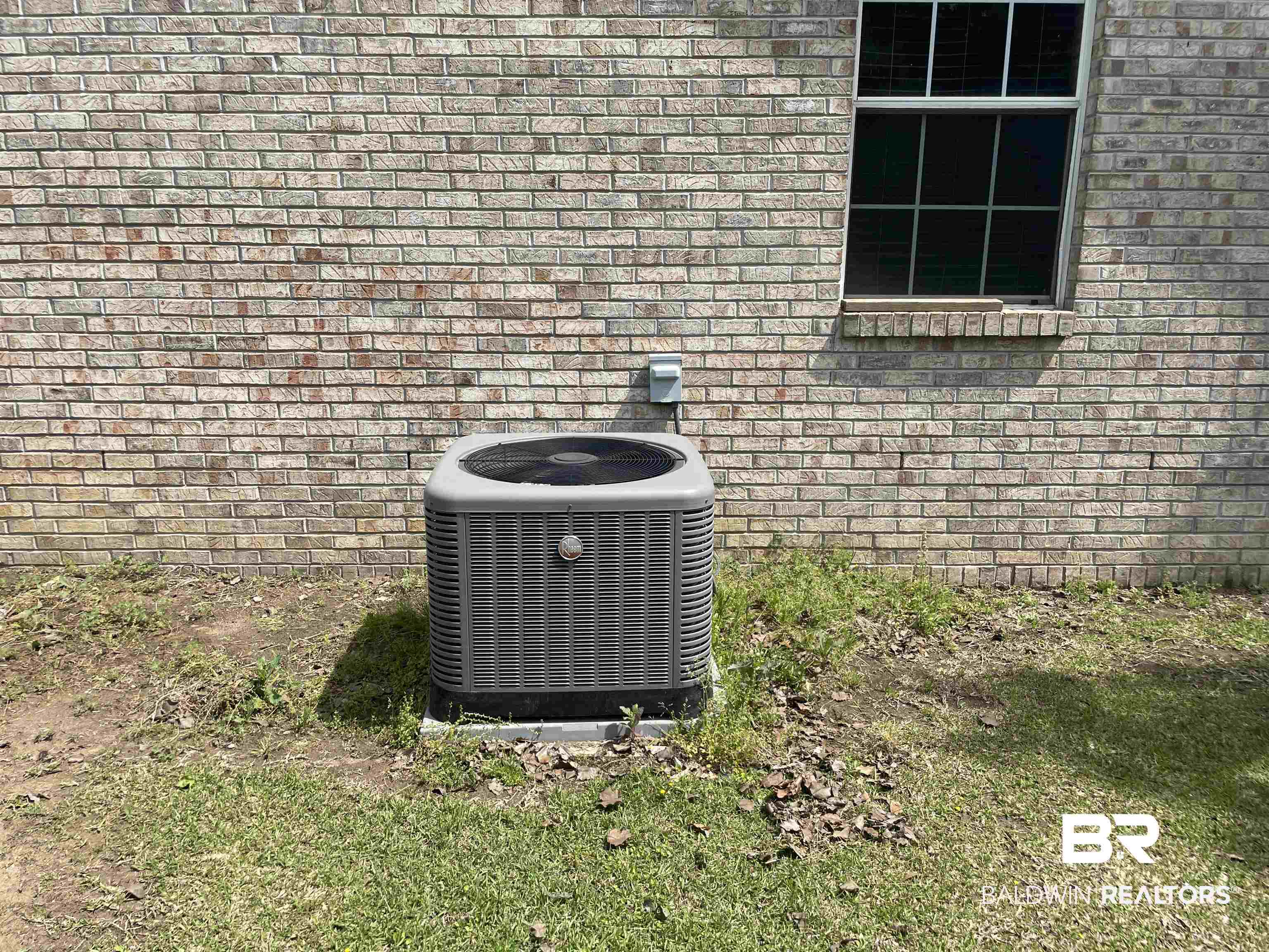 739 Smithfield Road Atmore, AL 36502 - Photo 14 of 18 Exterior details featuring brick siding and cooling unit