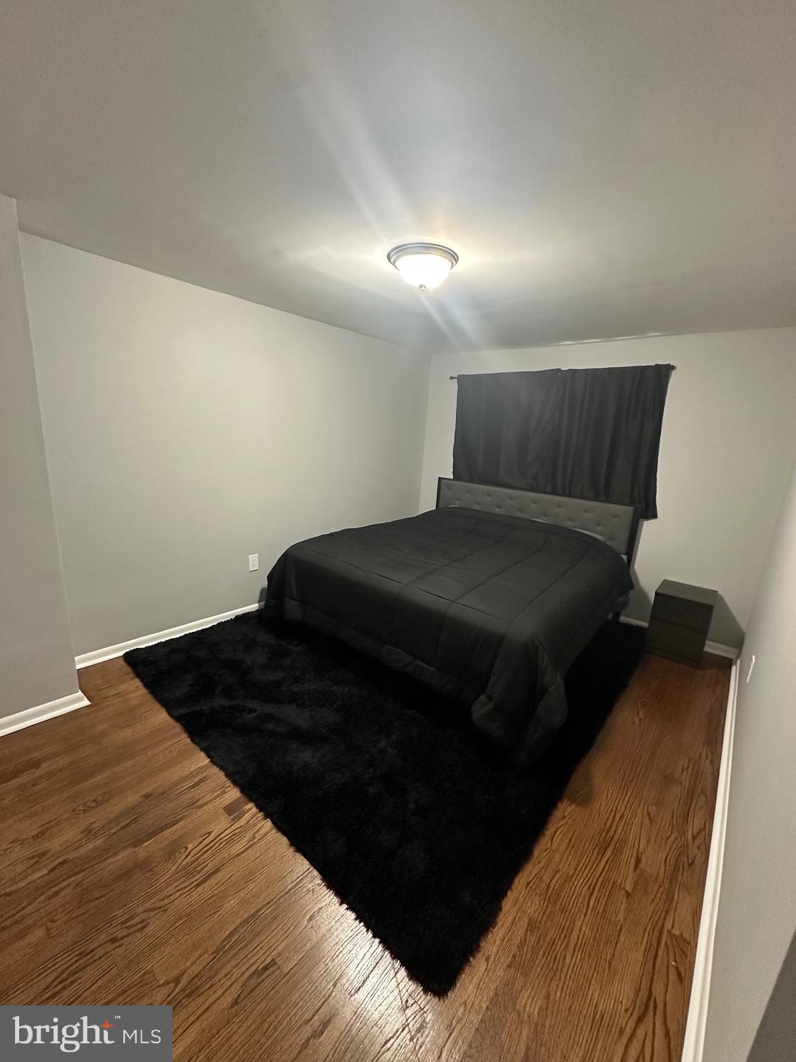 631 Charraway Road Baltimore, MD 21229 - Photo 11 of 25 a bedroom with a bed and a dresser