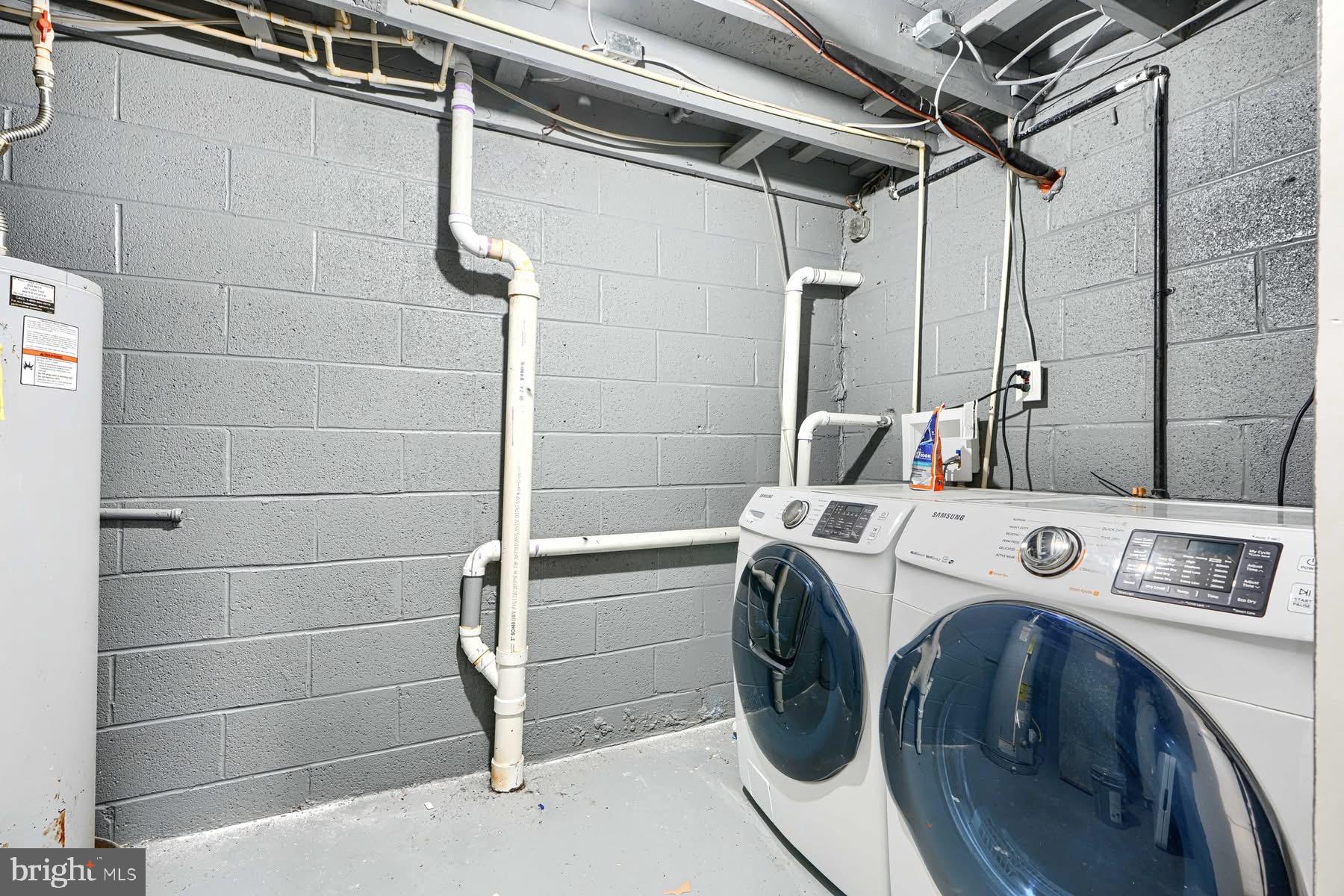 631 Charraway Road Baltimore, MD 21229 - Photo 22 of 25 a utility room with dryer and washer