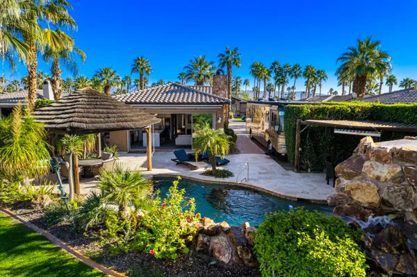 a view of a pathway both side of the house