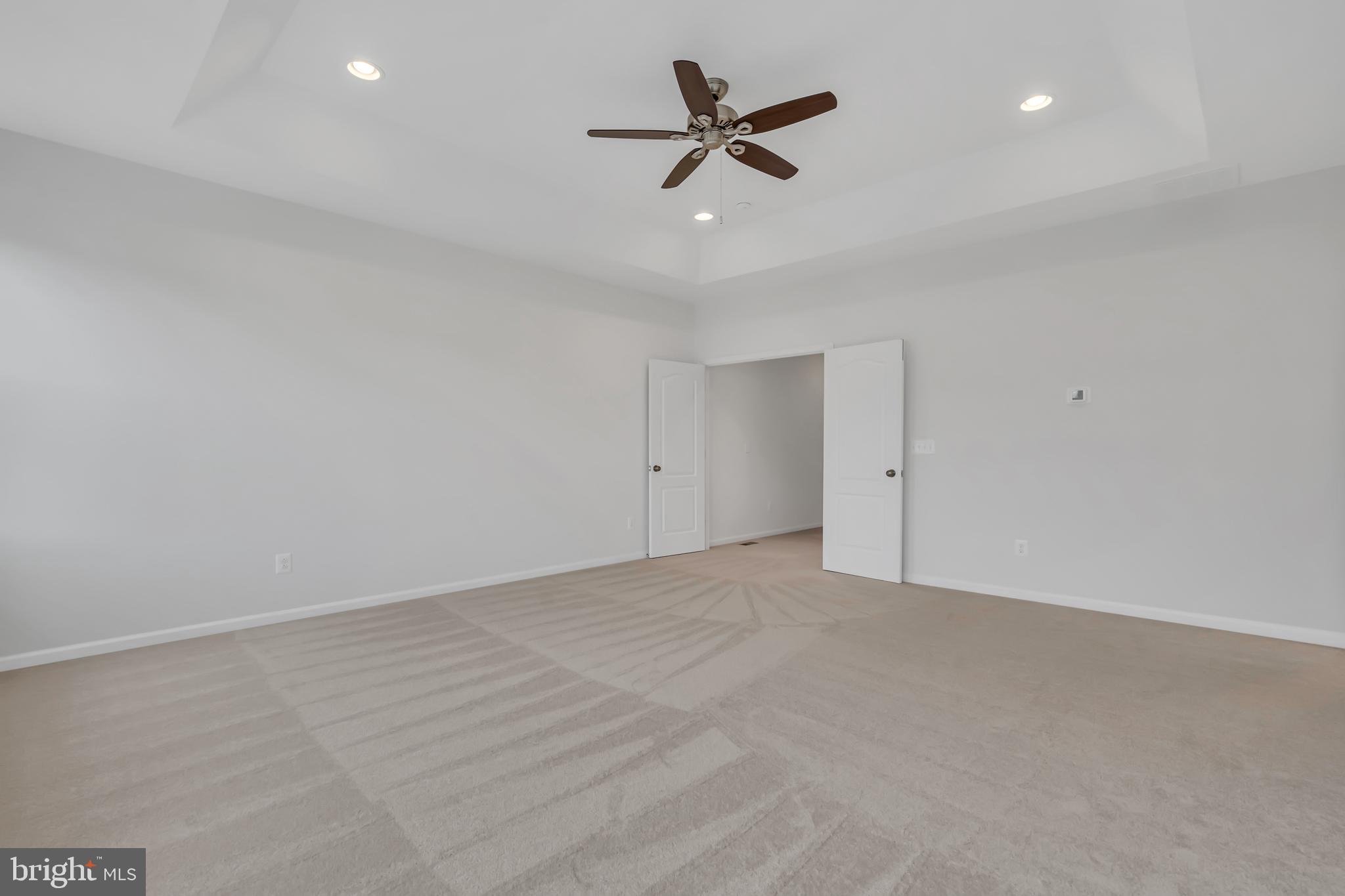 42482 Benfold Square Ashburn, VA 20148 - Photo 14 of 34 a view of an empty room with a ceiling fan