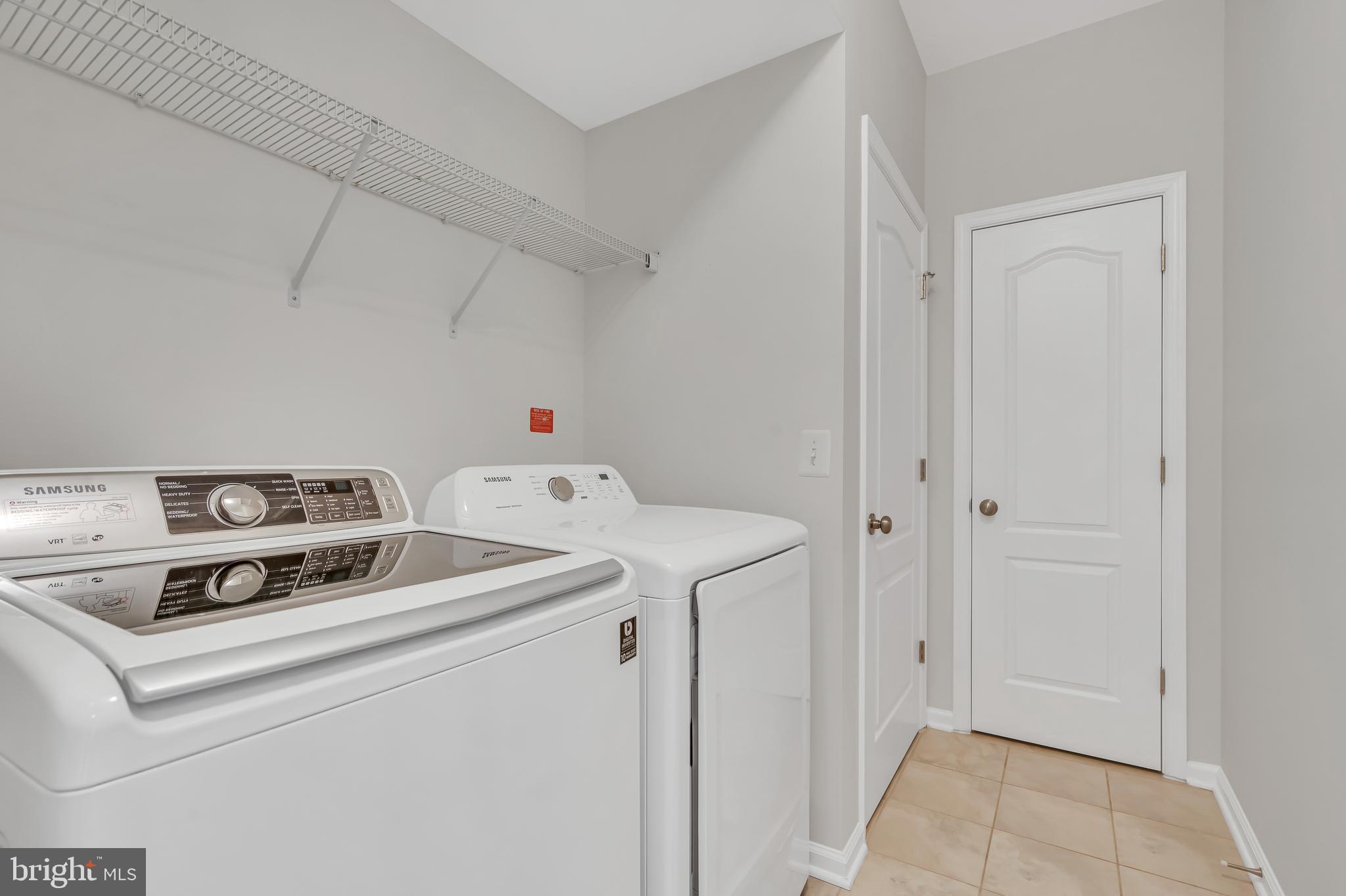 42482 Benfold Square Ashburn, VA 20148 - Photo 18 of 34 a utility room with dryer and washer