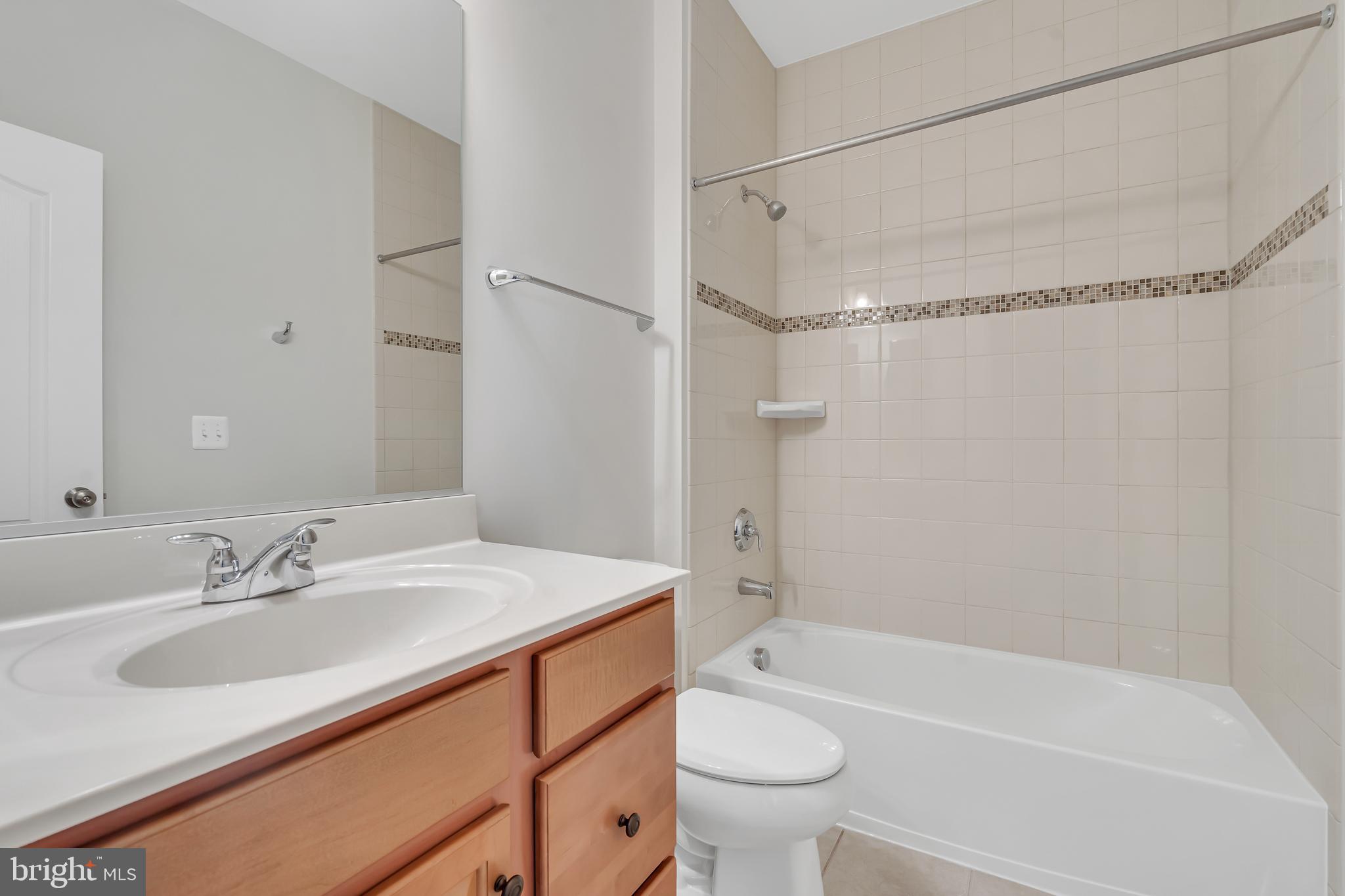 42482 Benfold Square Ashburn, VA 20148 - Photo 19 of 34 a bathroom with a sink toilet and shower