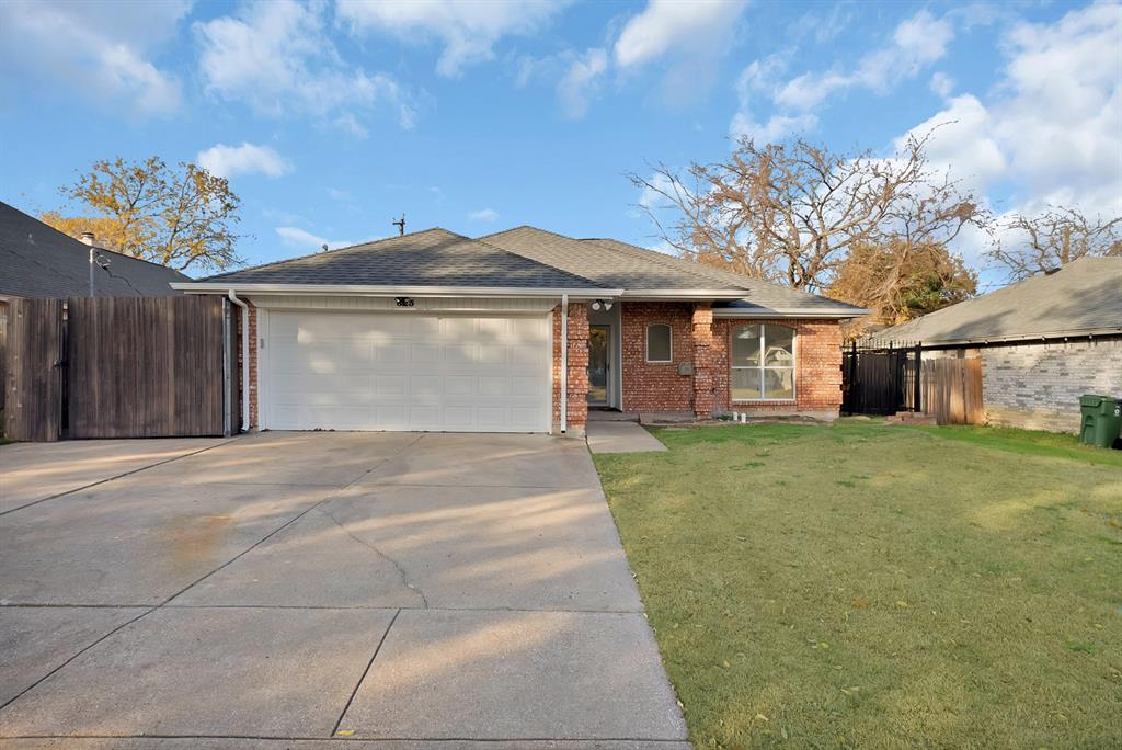 825 Meadowdale Road Arlington, TX 76017 - Photo 12 of 19 a front view of a house with a garden and trees