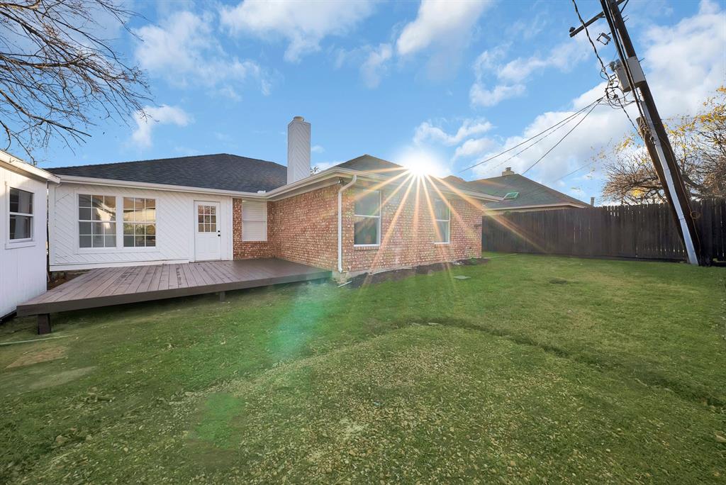 825 Meadowdale Road Arlington, TX 76017 - Photo 14 of 19 a view of a backyard with a garden