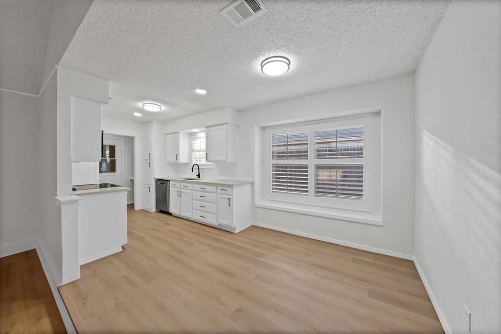 825 Meadowdale Road Arlington, TX 76017 - Photo 3 of 19 a view of a kitchen with a sink and a window