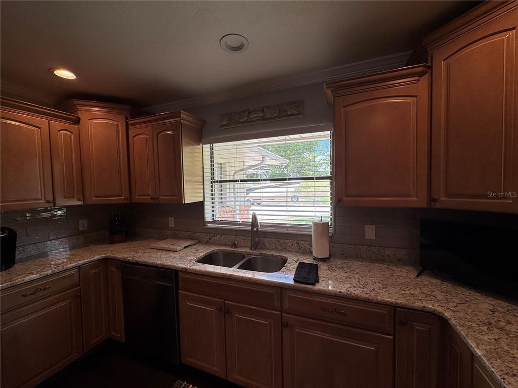 334 West F Street Frostproof, FL 33843 - Photo 15 of 48 a kitchen with a sink and a window