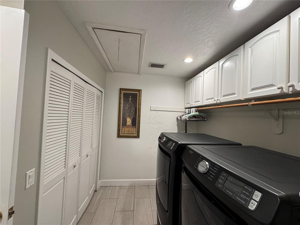 334 West F Street Frostproof, FL 33843 - Photo 17 of 48 a kitchen with a stove and a refrigerator