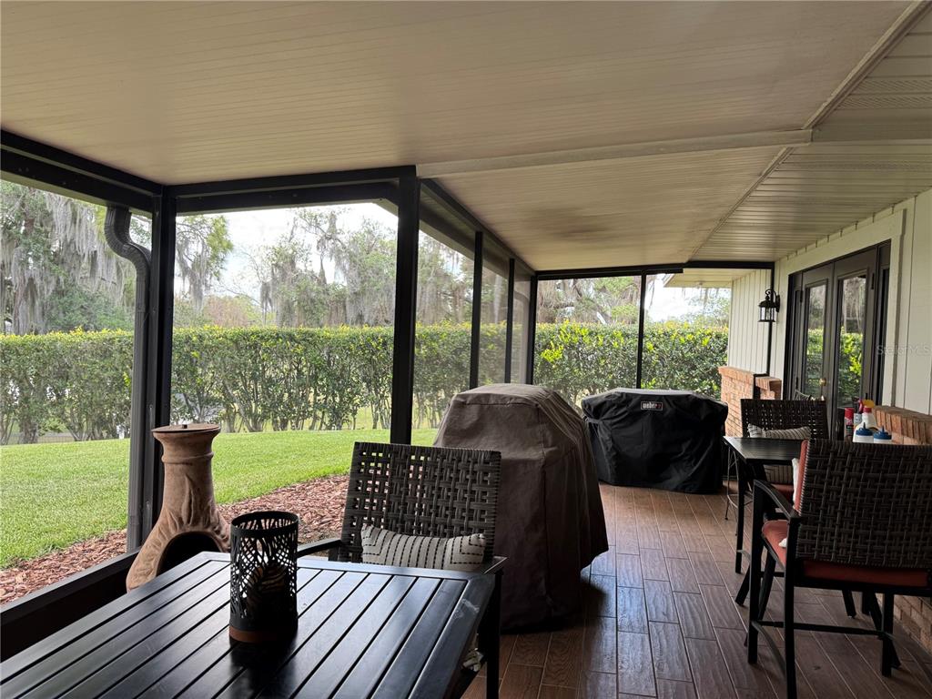 334 West F Street Frostproof, FL 33843 - Photo 33 of 48 a living room with furniture floor to ceiling window and an outdoor view
