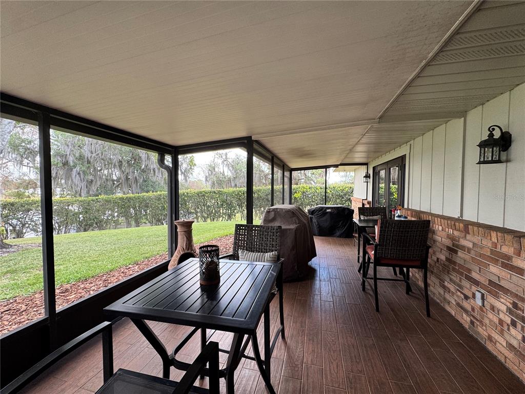 334 West F Street Frostproof, FL 33843 - Photo 34 of 48 a dining room with furniture window and wooden floor