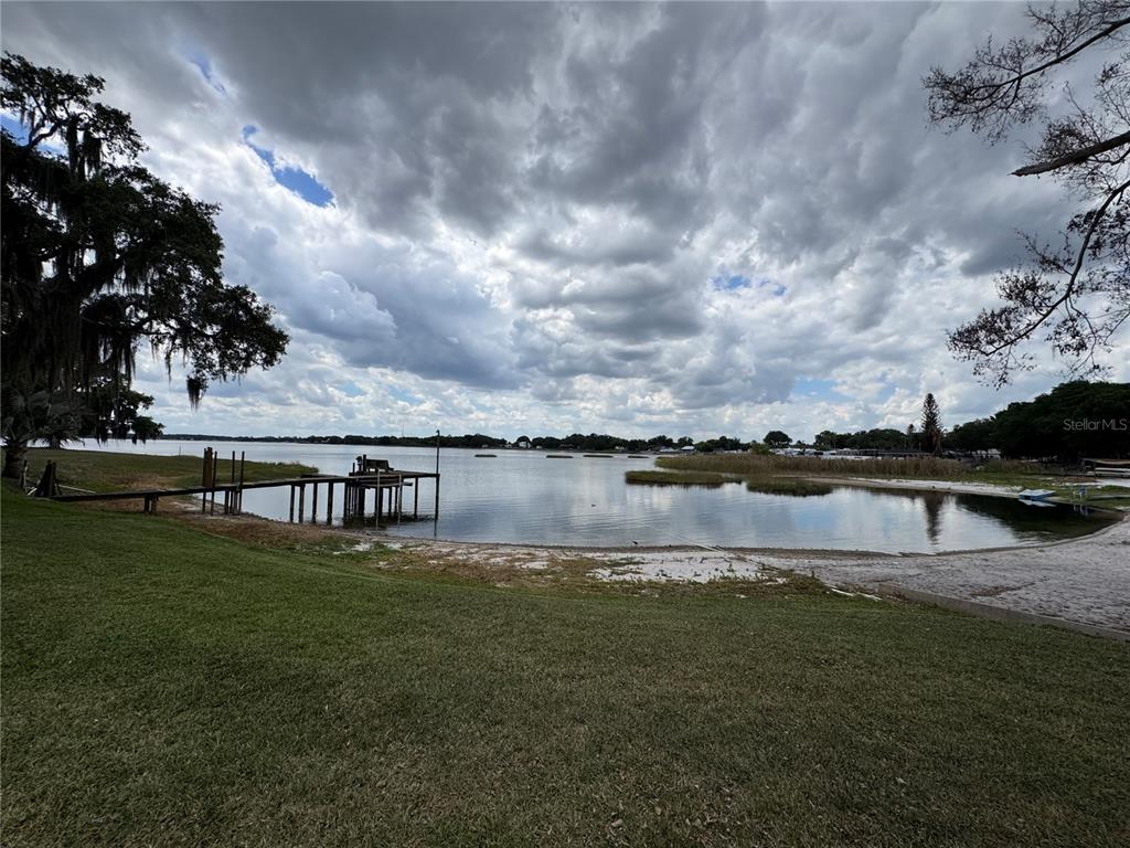 334 West F Street Frostproof, FL 33843 - Photo 35 of 48 a view of a lake with houses in the back