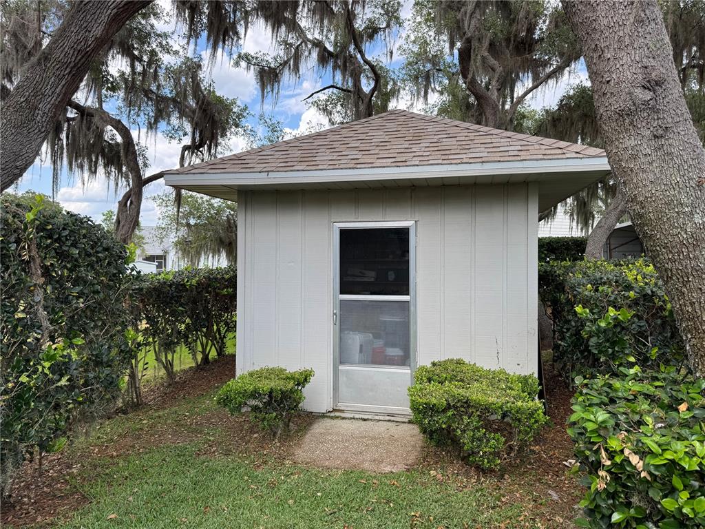 334 West F Street Frostproof, FL 33843 - Photo 47 of 48 a view of a house with a yard and plants