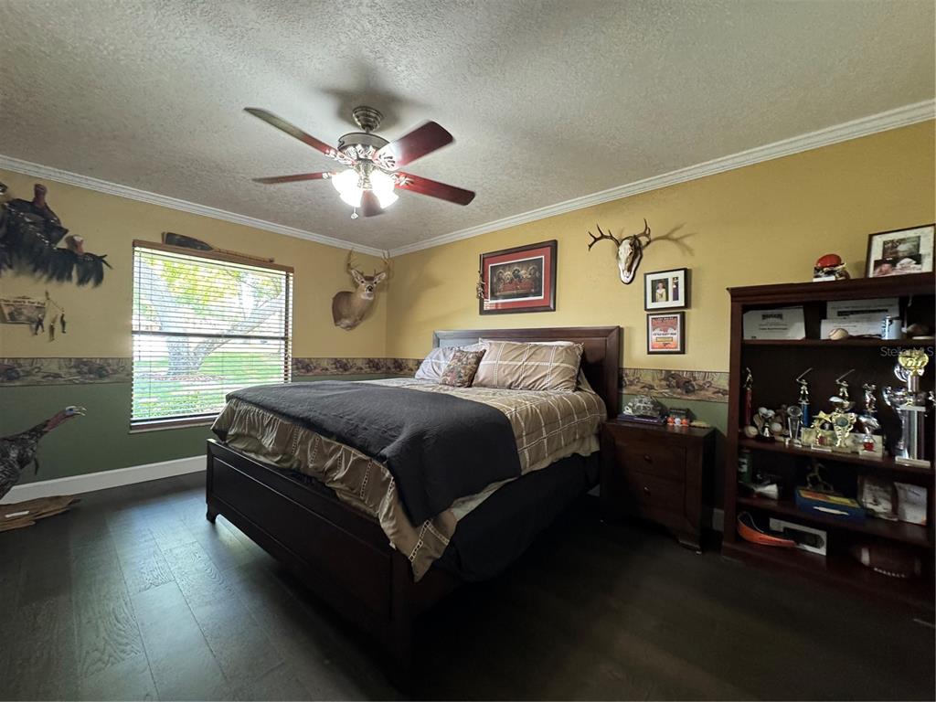 334 West F Street Frostproof, FL 33843 - Photo 6 of 48 a bedroom with a bed and window
