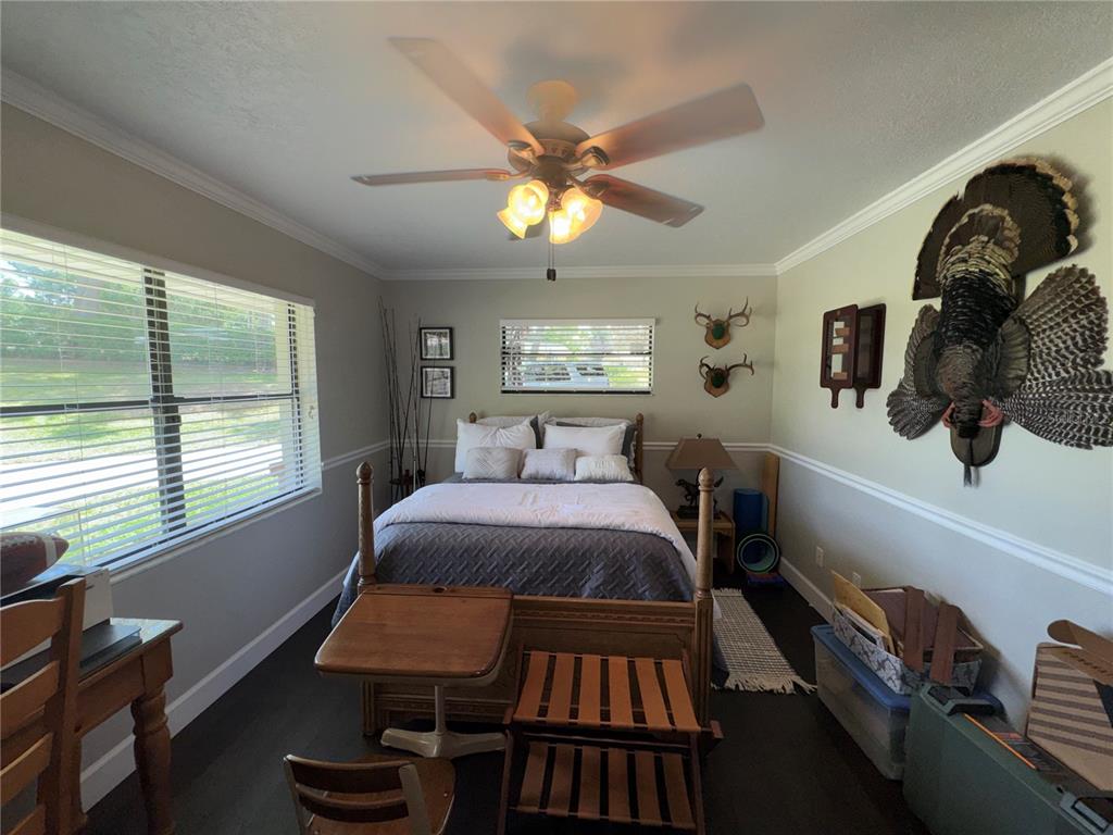 334 West F Street Frostproof, FL 33843 - Photo 9 of 48 a bedroom with a bed and window