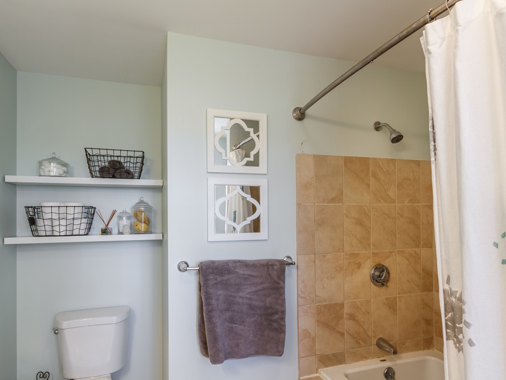69 Ledge Road, Unit 69 Seabrook, NH 03874 - Photo 15 of 17 a bathroom with a shower and a toilet