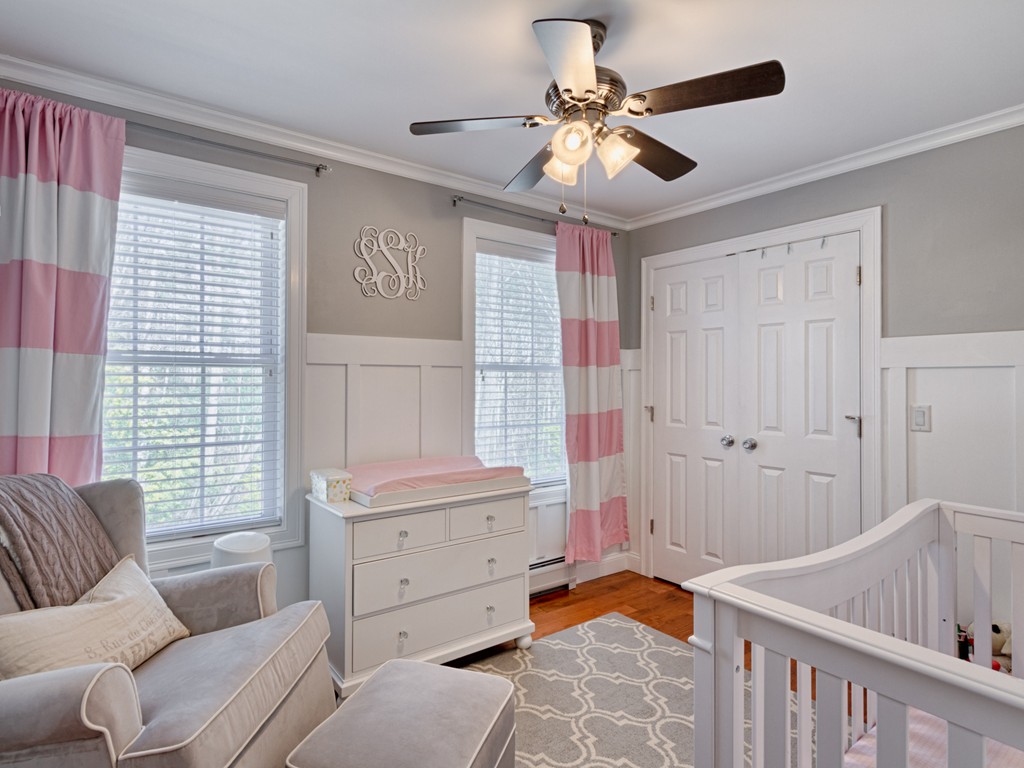 69 Ledge Road, Unit 69 Seabrook, NH 03874 - Photo 2 of 17 a bedroom with furniture and windows