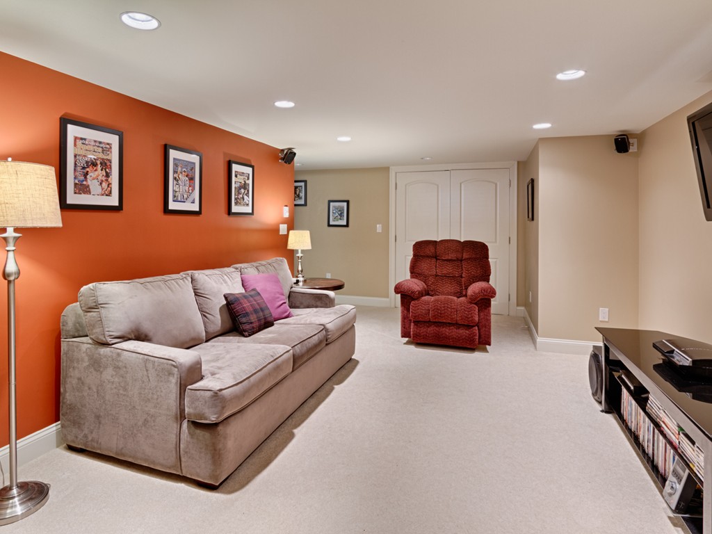 69 Ledge Road, Unit 69 Seabrook, NH 03874 - Photo 6 of 17 a living room with furniture and a couch