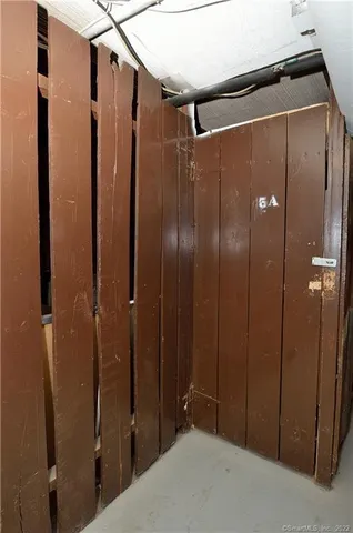 a bathroom with a shower and a glass door