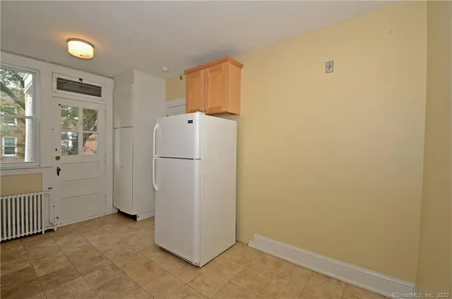 a view of a storage & utility room with a window