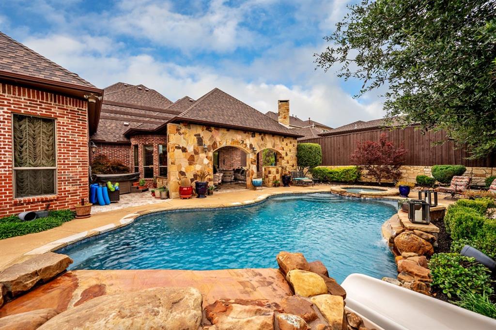 a view of a swimming pool with outdoor seating