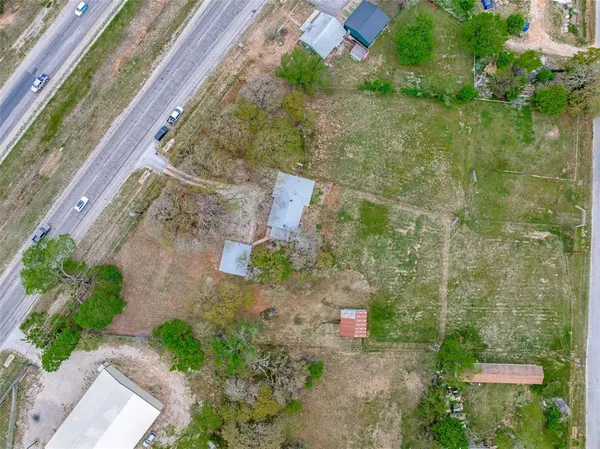 a picture of a yard with a lake view