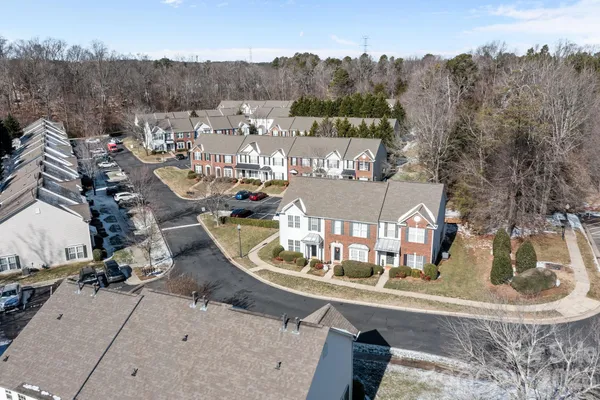 an aerial view of a house with outdoor space