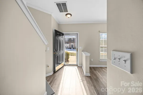 a view of a hallway with a living room