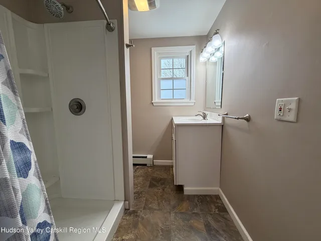 a view of an empty room with windows