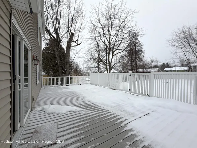 a view of a backyard with a bench