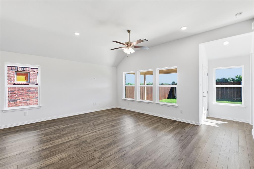 2529 Rivers W Road Anna, TX 75409 - Photo 20 of 40 Spacious living area featuring wood-finish flooring, a vaulted ceiling, and recessed lighting