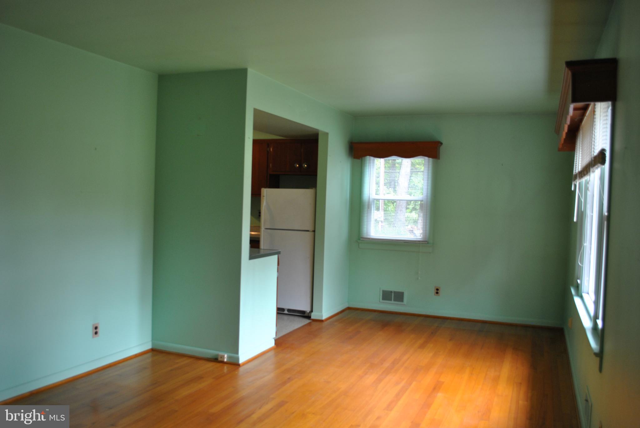 4902 Dumfries Road Catlett, VA 20119 - Photo 19 of 24 a view of empty room with window and wooden floor