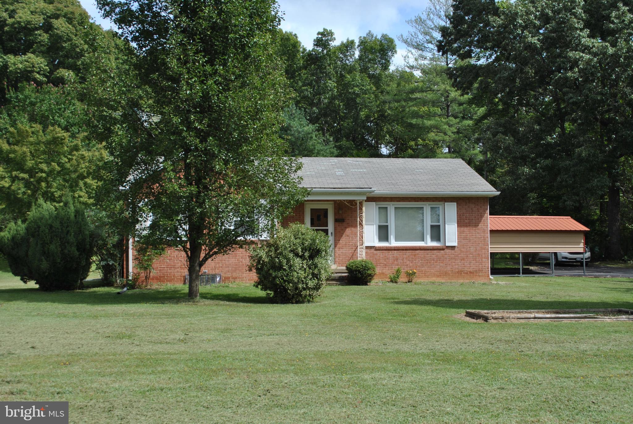 4902 Dumfries Road Catlett, VA 20119 - Photo 4 of 24 a front view of a house with garden
