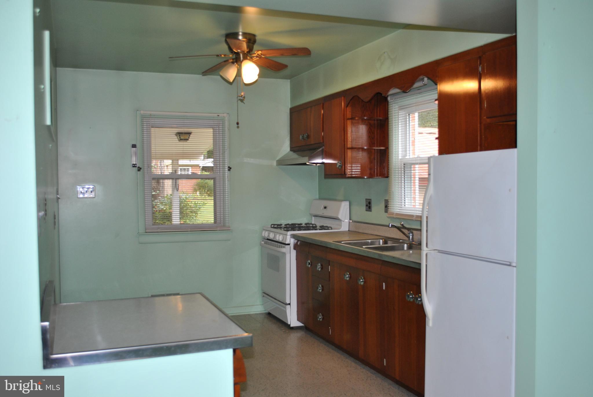 4902 Dumfries Road Catlett, VA 20119 - Photo 10 of 24 a kitchen with stainless steel appliances granite countertop a stove a sink and a refrigerator