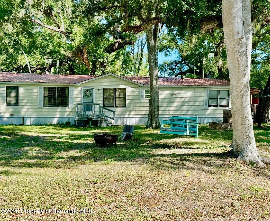 11340 Southwest 28th Way Webster, FL 33597 - Photo 36 of 38 Notice the amazing beautiful Metal Roof.