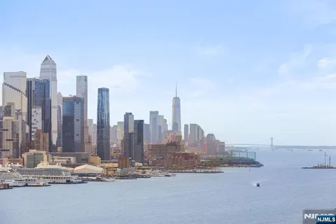 a view of a city with tall buildings in the background