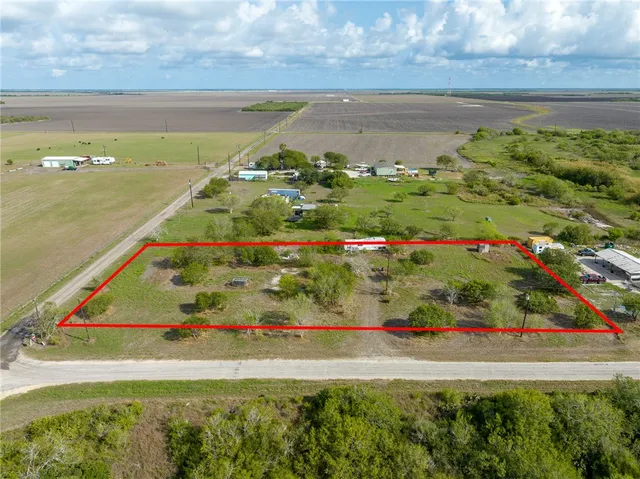 a view of a lake with a large pool table and chairs