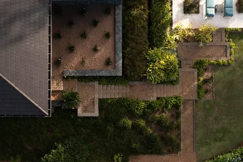 a view of a house with a yard patio and swimming pool