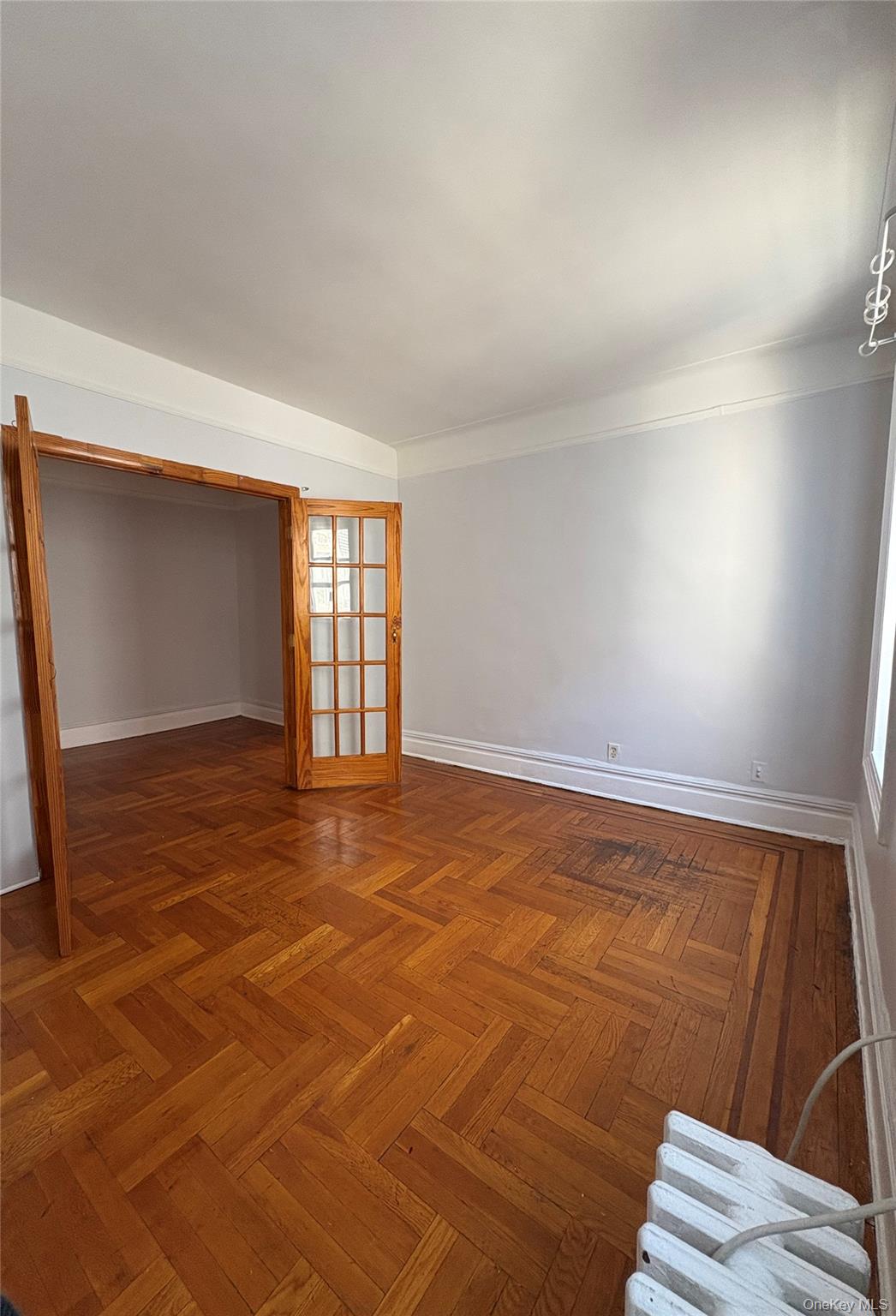 5005 43rd Avenue, Unit 5H Queens, NY 11377 - Photo 17 of 23 Spare room with baseboards