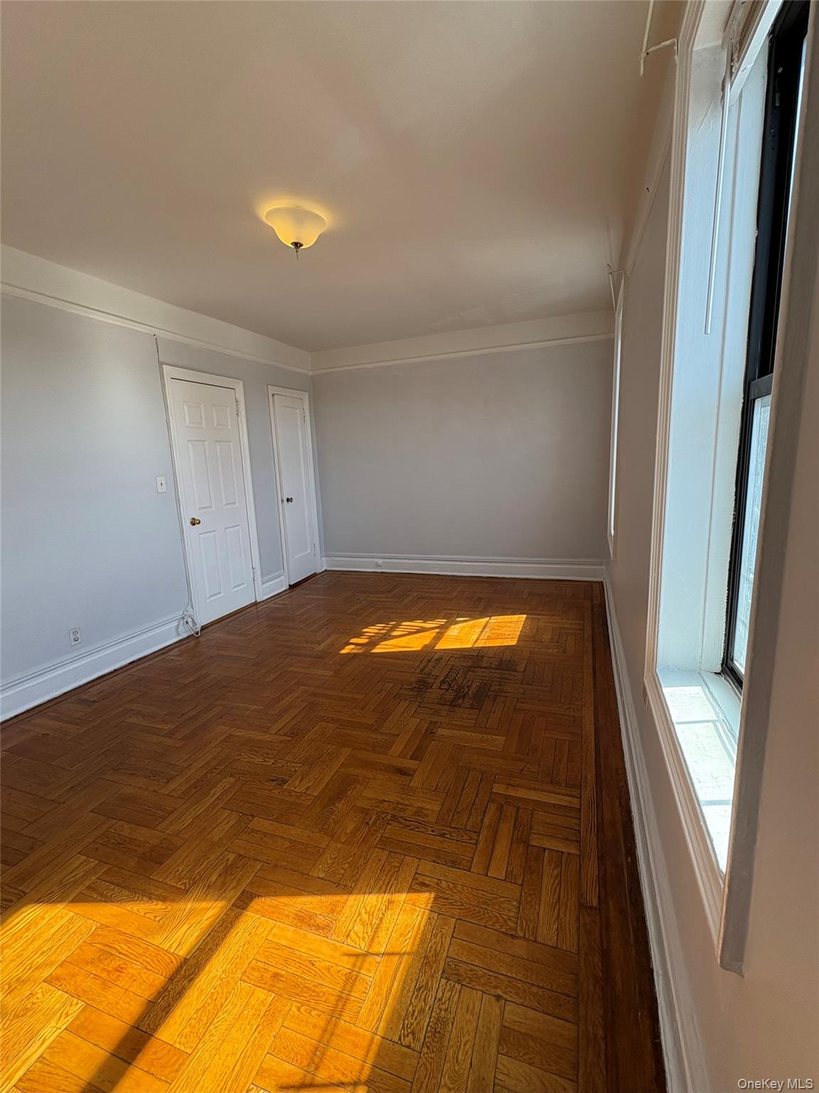 5005 43rd Avenue, Unit 5H Queens, NY 11377 - Photo 21 of 23 Hallway featuring baseboards
